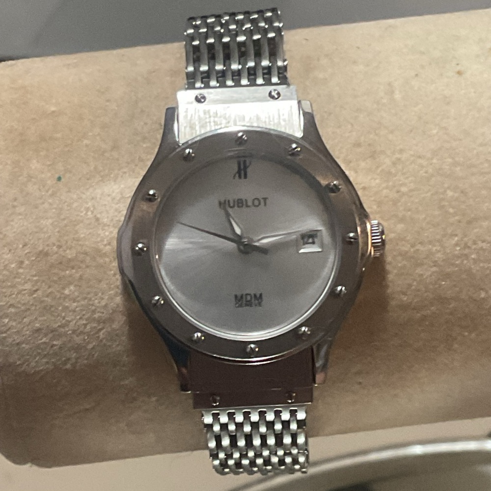 Hublot Silver Smartwatch with Signature Design.. some scratches on the back.